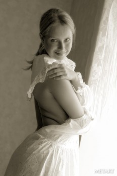 Blonde girl in a black and white posing scene