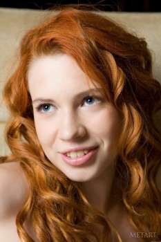Ginger chick shows hairy pussy on floor.
