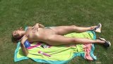 Filthy blonde is enjoying solo in the garden. She is covering her naked body with oil and drilling her lovely twat with long pink dildo.