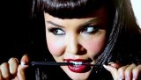 Slutty babe is demonstrating her sensational solo skills in the empty room. She is holding big black umbrella and touching her naked body with care.