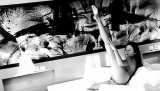 Watch this black and white clip featuring young gorgeous brunette. She is demonstrating her sensational solo skills with a happy smile on face.