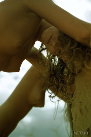 Two models posing naked on a sunny beach photo 6