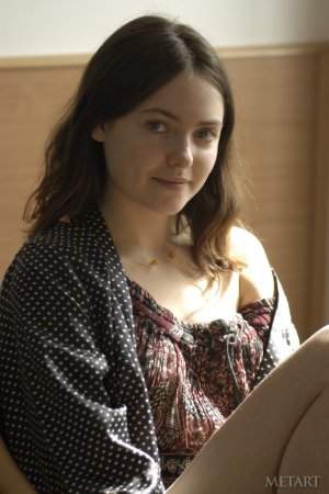 Wonderful cutie is undressing herself photo 1