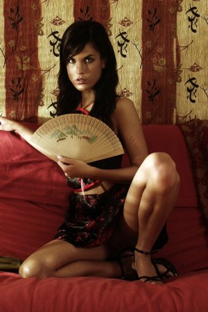 Dark-haired beauty undressing photo 13