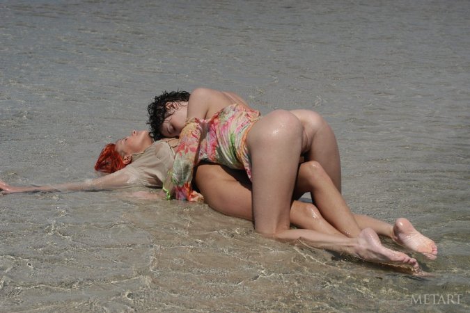 Tight lesbies playing in the water photo 5