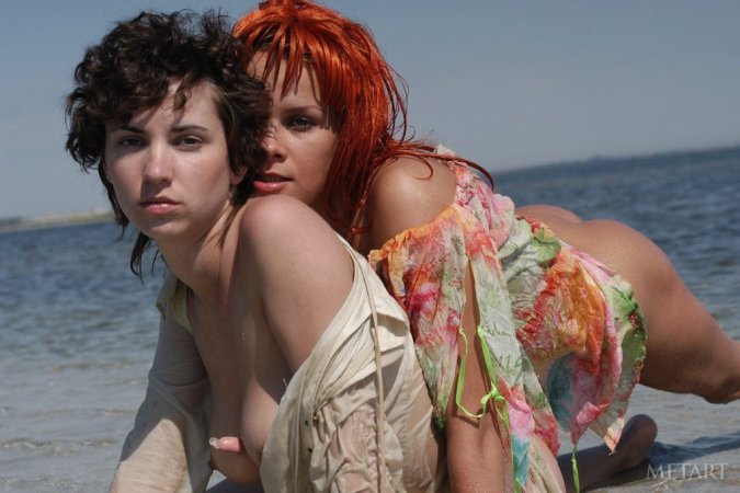 Tight lesbies playing in the water photo 8