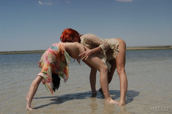 Tight lesbies playing in the water photo 15