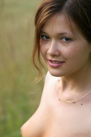 Watch a fine babe jump in the field. photo 4