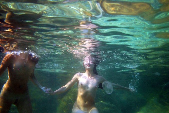 Swimming with two beautiful babes photo 1