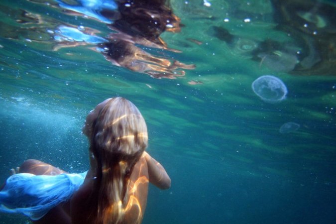 Swimming with two beautiful babes photo 2