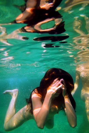 Swimming with two beautiful babes photo 4