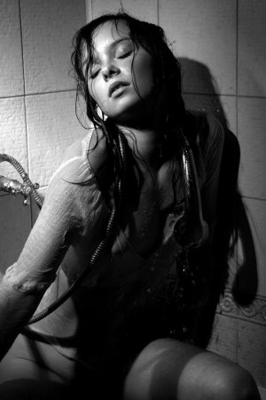 Black haired young model under the shower photo 1