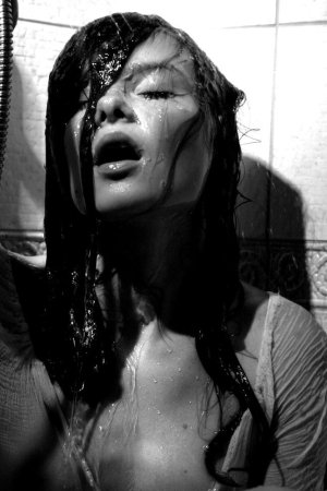 Black haired young model under the shower photo 3