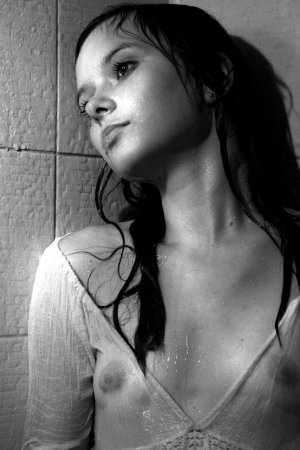 Black haired young model under the shower photo 7