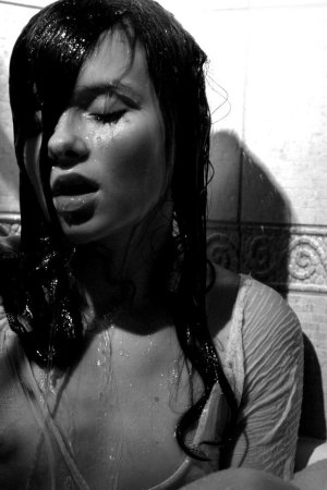 Black haired young model under the shower photo 10