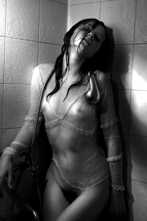Black haired young model under the shower photo 11