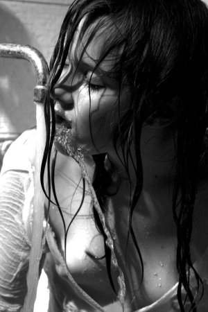 Black haired young model under the shower photo 13