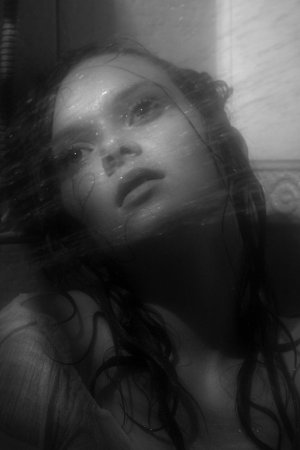 Black haired young model under the shower photo 14