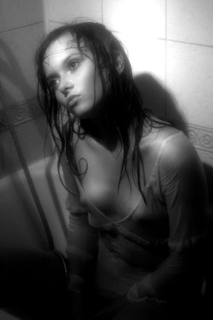 Black haired young model under the shower photo 15