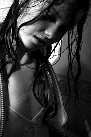 Black haired young model under the shower photo 16