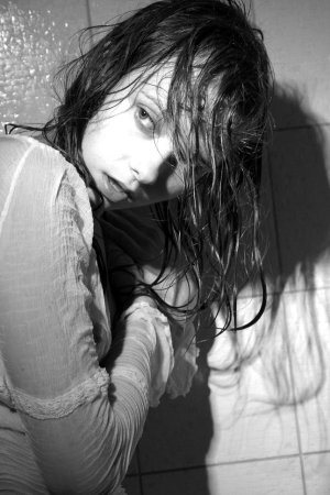 Black haired young model under the shower photo 17