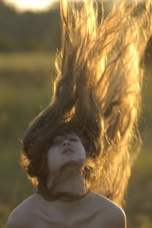 Long haired girl with curves posing in nature photo 12