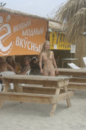 Hot girl gets naked on an ordinary beach photo 15