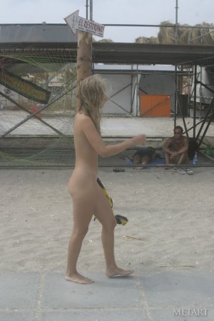 Hot girl gets naked on an ordinary beach photo 17