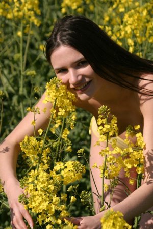 Excellent girl in the middle of a flower field photo 9