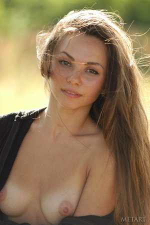 Sweetie rubs shaved pussy against the branch. photo 14