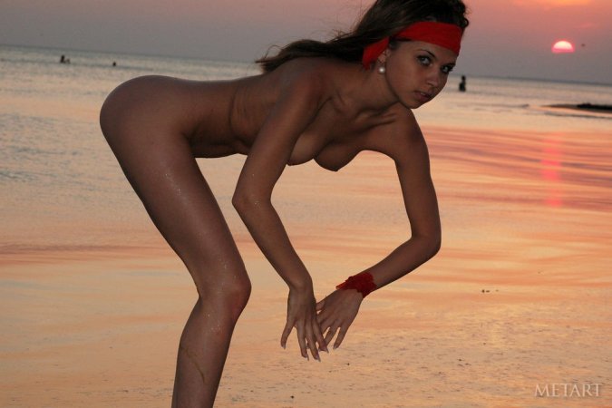Beach posing scene with a hot brunette photo 13