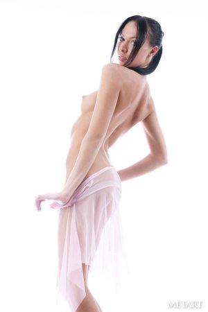 Petite teen is making sexy poses photo 2