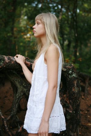 Slim blondie lady posing in a forest photo 7