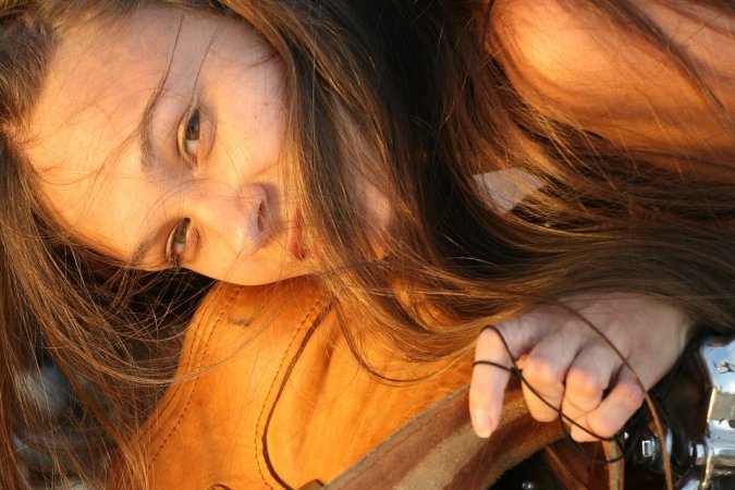 Hot hippie chick posing by her motorbike photo 16