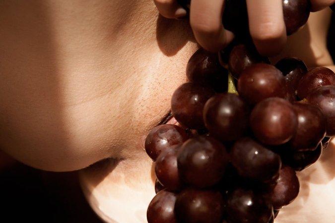 Sexy redhead enjoying her grapes photo 9
