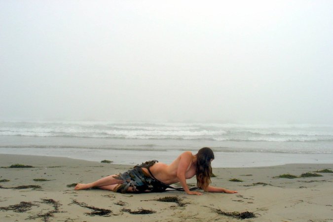 Getting close to the nature while nude photo 7