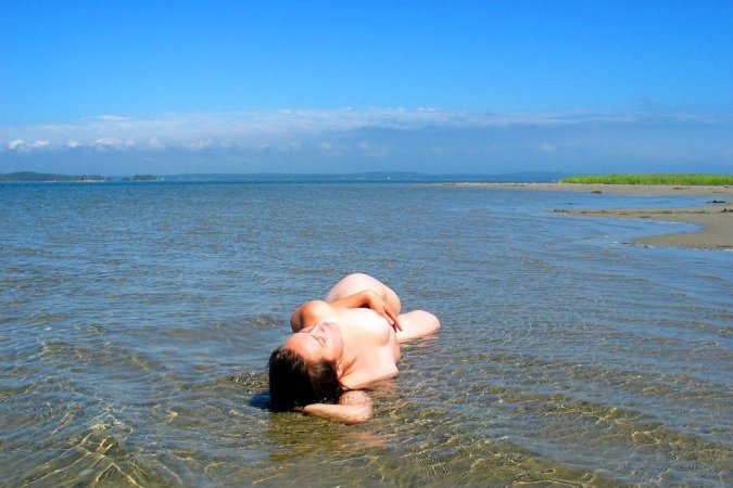 Getting close to the nature while nude photo 10