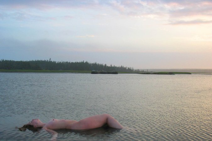 Getting close to the nature while nude photo 13