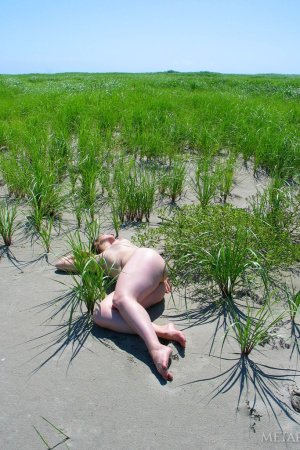 Getting close to the nature while nude photo 14