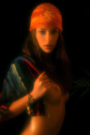 Serious looking chick is undressing photo 10