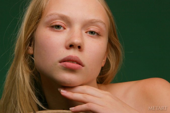 Blonde is next to an old fashioned wheel photo 3