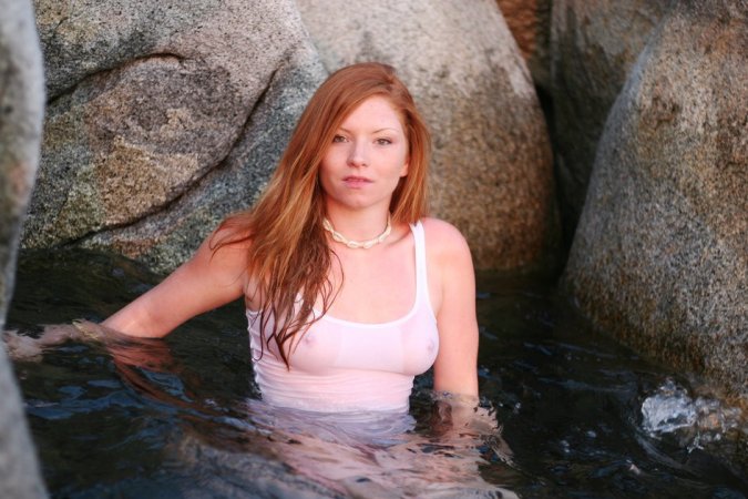 Redhead takes a swim in the sea photo 16