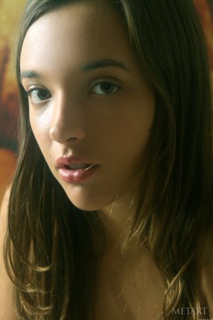 Relaxed brunette flaunts her sexy tits photo 4