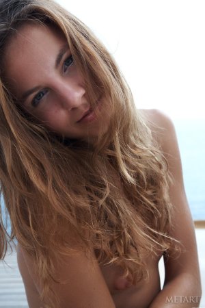 Skinny babe teases shaved pussy in pool. photo 5