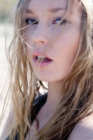 Playfully naked and posing at the sea photo 9