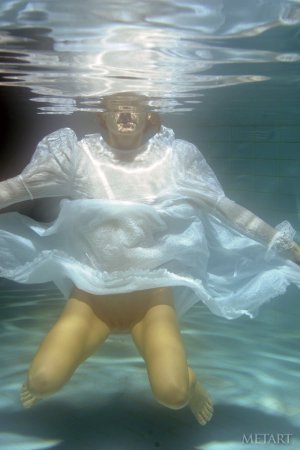A redhead is dipping in the swimming pool photo 17