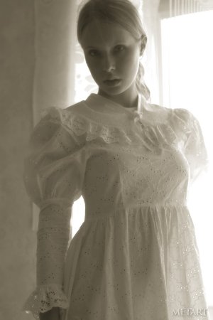 Blonde girl in a black and white posing scene photo 1