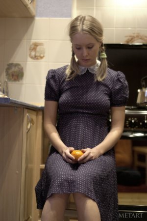 Hot blonde is playing with an orange today photo 1