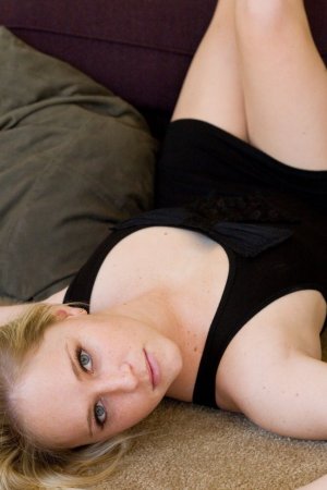 Innocent looking blonde is on the sofa photo 11