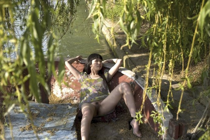Cute chick is naked by the river photo 14